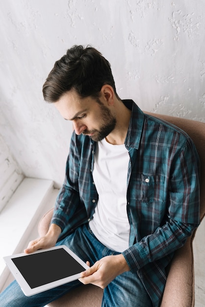 Free photo from above man using tablet