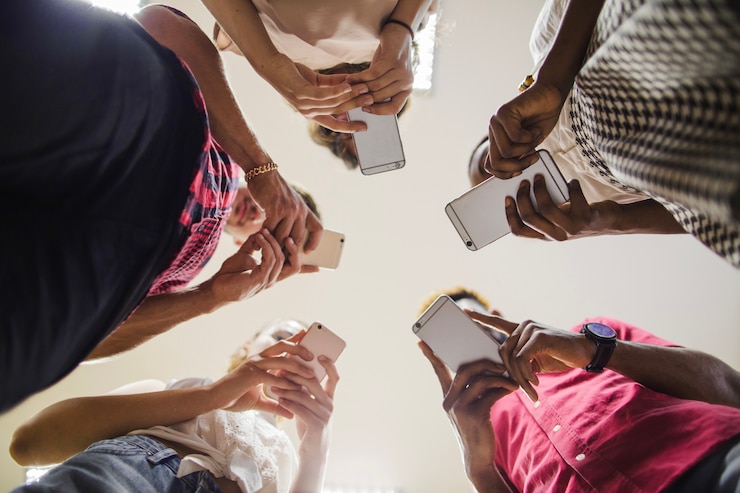 Free Photo from below shot of students with phones