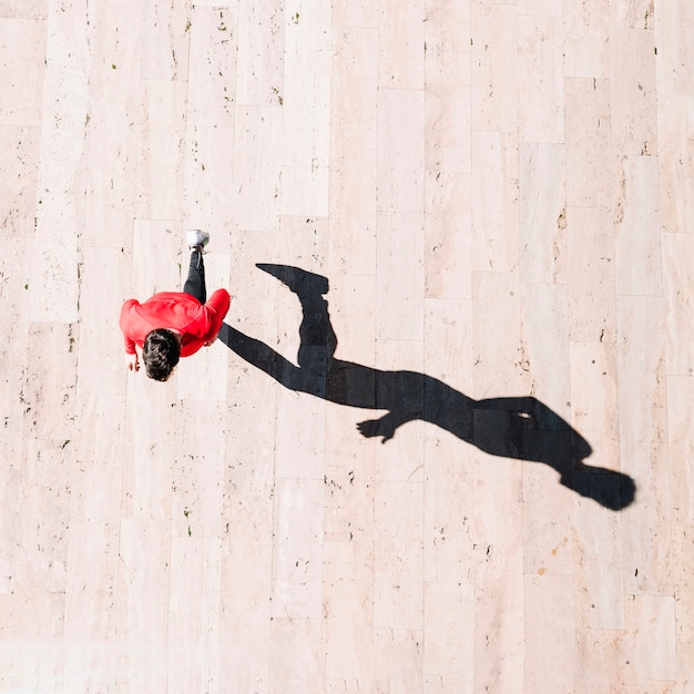 From above sportsman running during training