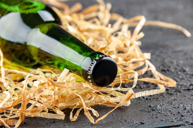 Front close view bottles of beer on dark background drink lemonade color photo alcohol