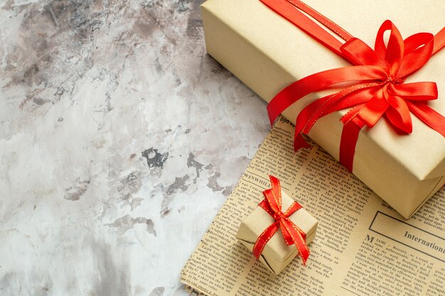 Front close view christmas presents with red bows on white background