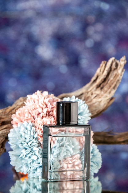 Free photo front close view expensive perfume with flowers on bright table