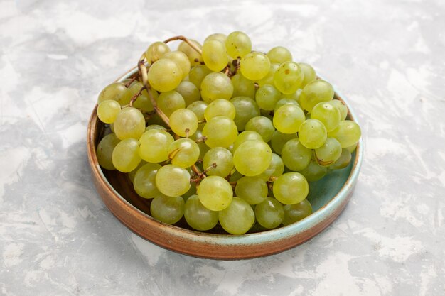 Front close view fresh green grapes juicy mellow sweet fruits on white desk fruit fresh mellow juice wine