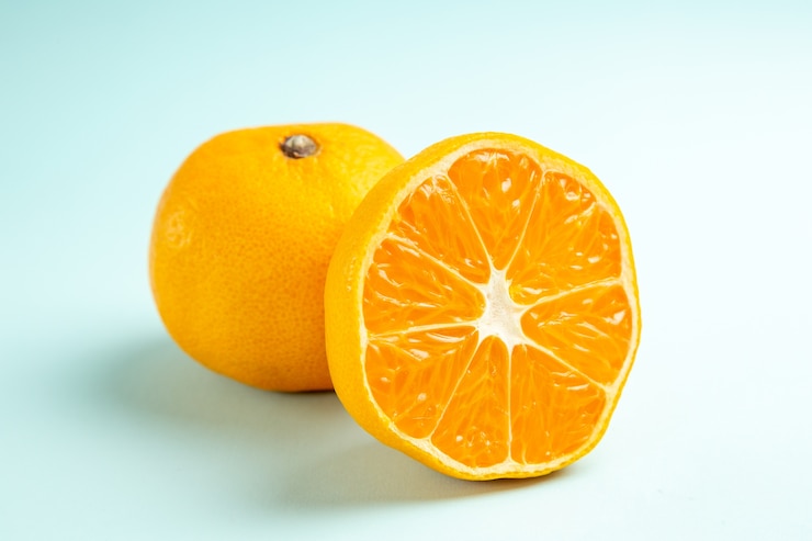 Free Photo front close view fresh tangerine slices on light-blue table