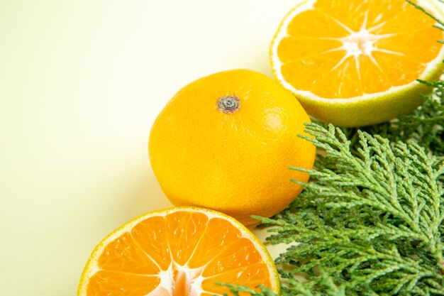 Front close view fresh tangerines on white table