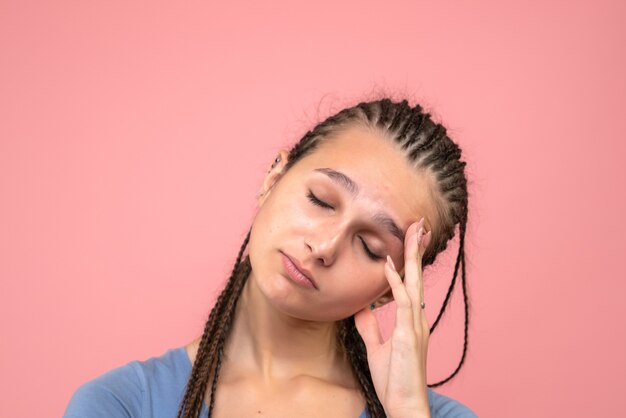 Front close view young girl stressed on pink