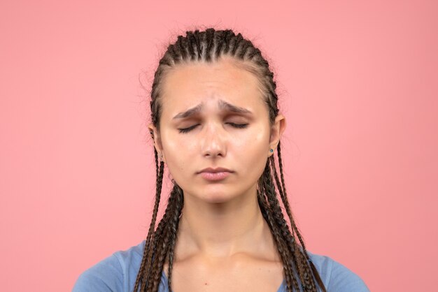 Front close view young girl stressed and sad on pink