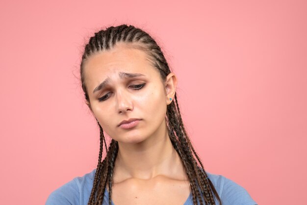 Front close view young girl stressed and sad on pink