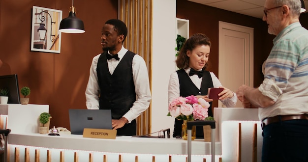 Free photo front desk staff checking passports