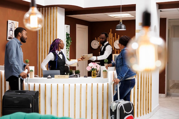 Front desk staff managing guest checkin