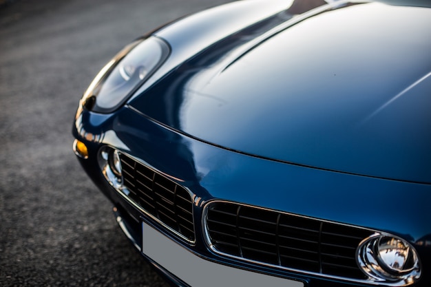 Front hood and headlight of a black car