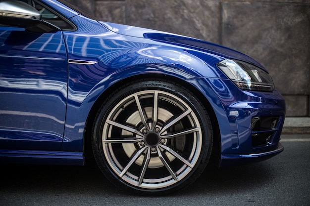 Front right side of a blue sedan car Free Photo