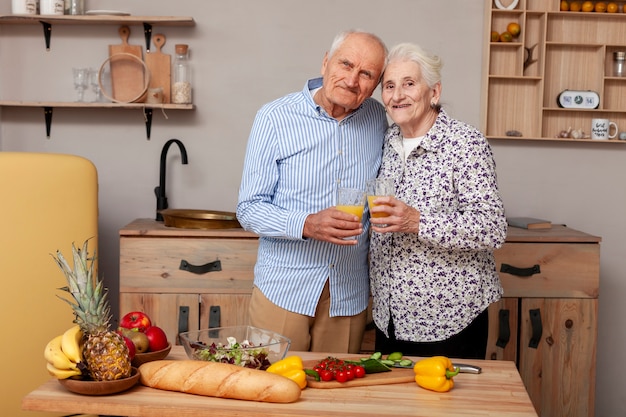 Free photo front view adorable couple in the kitchen