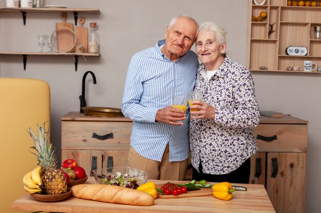 Front view adorable couple in the kitchen