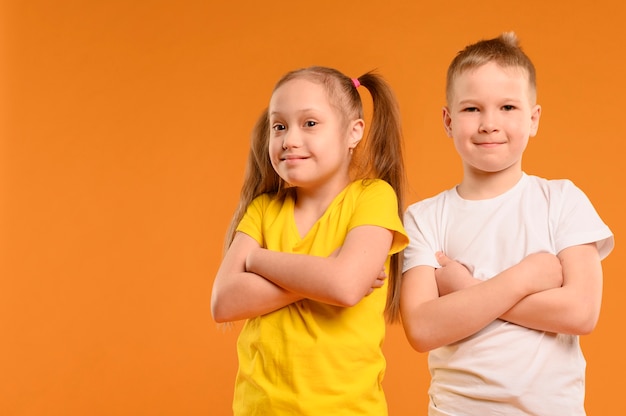 Front view adorable young boy and girl