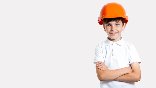 Front view adorable young boy with safety helmet