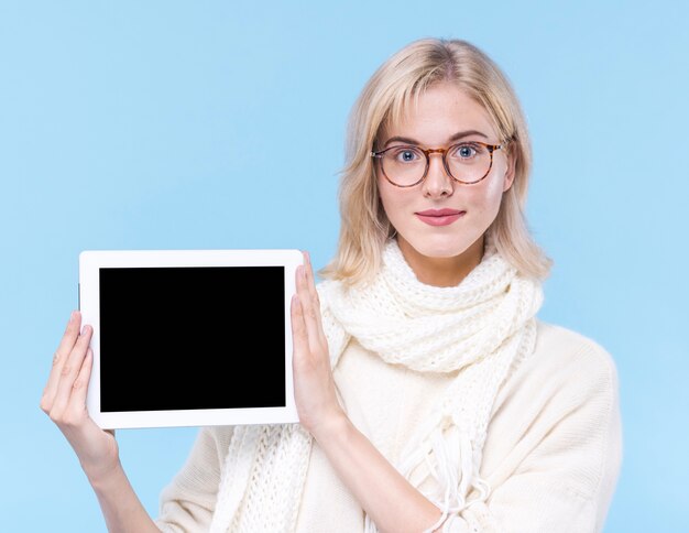 Front view adult woman holding a tablet