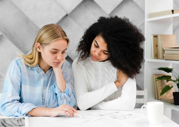 Free photo front view adult women working on a project