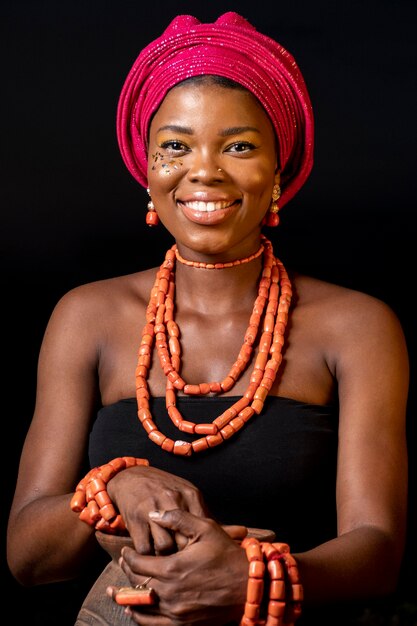 Front view african woman wearing traditional accessories