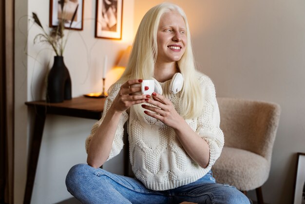 Front view albino woman at home