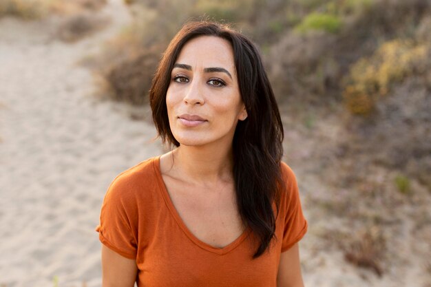 Front view of alluring woman outdoors at the beach