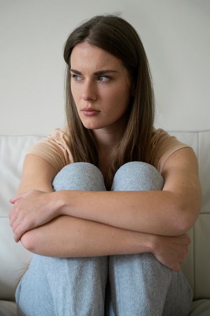 Front view anxious woman at home