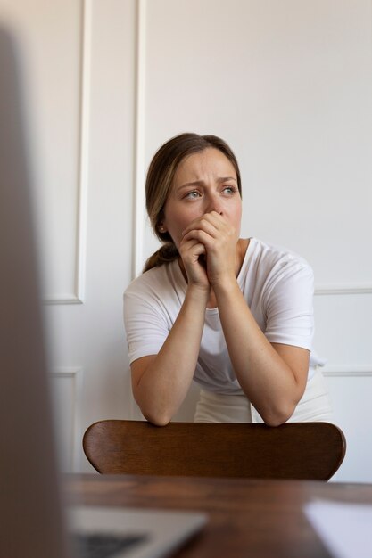 Front view anxious woman indoors