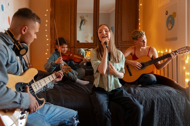 Front view artists making music in bedroom