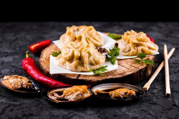 Front view asian dumplings and oysters