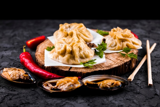 Front view asian dumplings and oysters