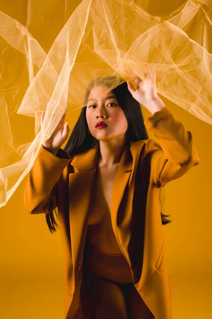 Front view asian model with yellow background