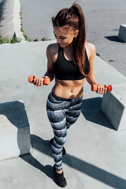 Free photo front view of athlete doing weight training