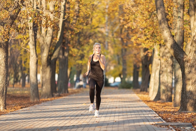 Free photo front view athletic woman running