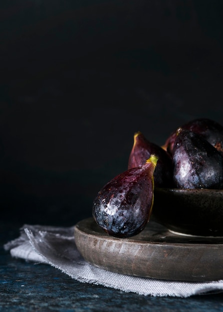 Front view of autumn figs on plate with copy space