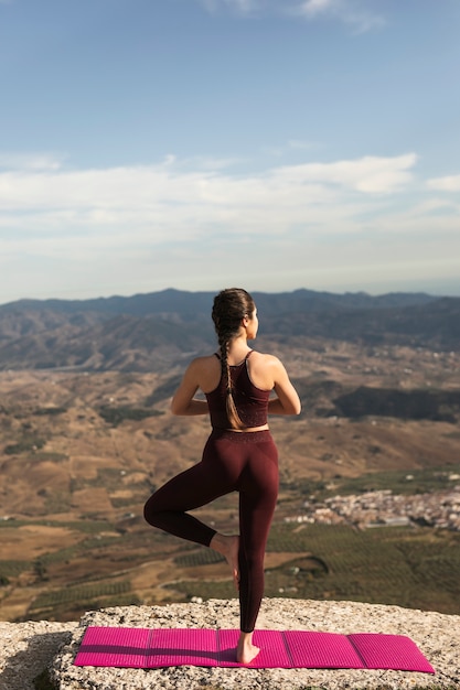 Free photo front view back pose of yoga practice