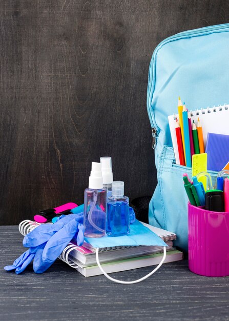 Front view of back to school stationery with backpack and pencils