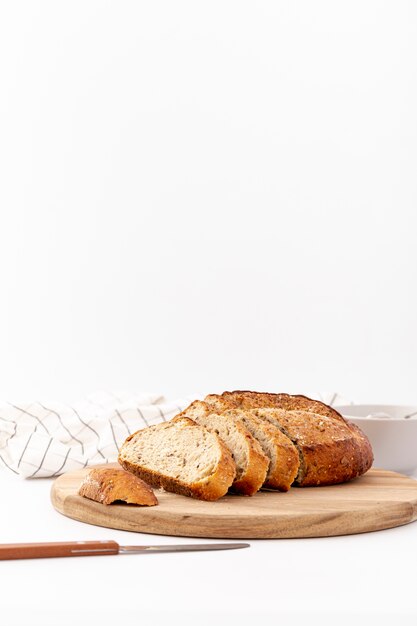 Front view baked bread on wooden board with copy space