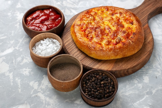 Front view baked pie with seasonings on white