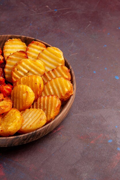 Front view baked potatoes with cooked vegetables on a dark space