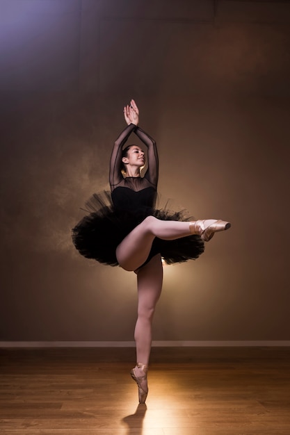 Front view ballerina dancing happily