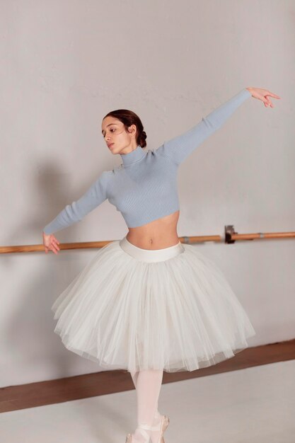 Front view of ballerina dancing  in tutu skirt