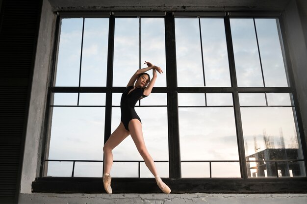 Front view of ballerina in leotard dancing