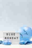 Free photo front view of balloon with frown for blue monday