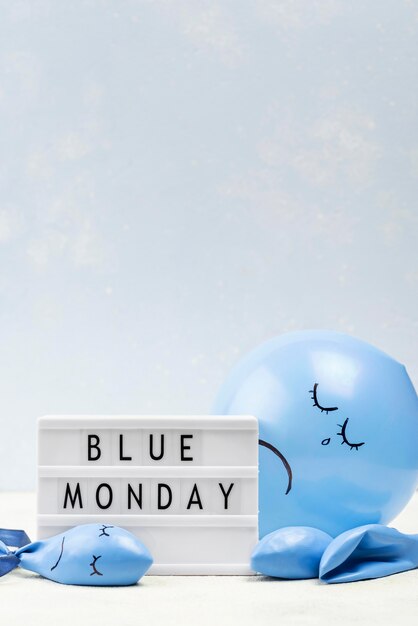 Front view of balloon with frown for blue monday