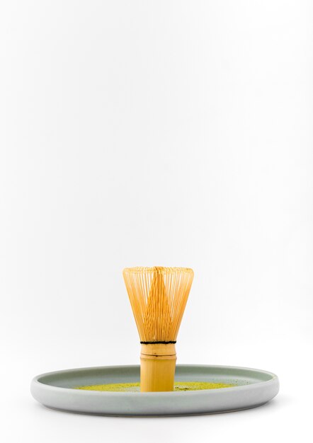 Front view bamboo whisk on a tray