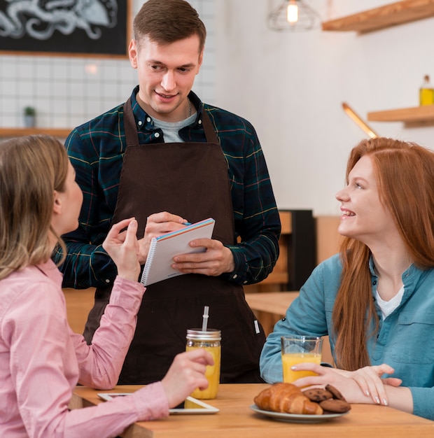 Front view of barista taking an order