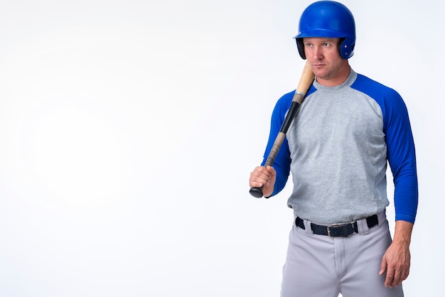 Free photo front view of baseball player with copy space