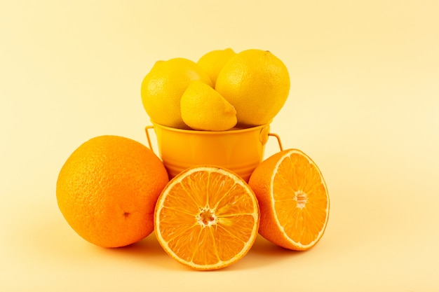 A front view basket with lemons sliced whole fresh mellow and juicy along with orange slices on the cream colored background