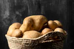 Free photo front view of basket with potatoes
