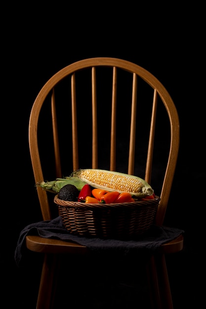 Front view basket with veggies on chair